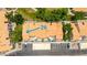 Aerial view of a well-maintained townhome community with mature trees, and designated resident parking at 500 N Roosevelt Ave # 26, Chandler, AZ 85226