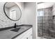 Bathroom features a modern sink and updated shower with a glass enclosure at 500 N Roosevelt Ave # 26, Chandler, AZ 85226