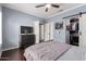 Bedroom featuring a dark wood dresser, flat screen TV and closet at 500 N Roosevelt Ave # 26, Chandler, AZ 85226