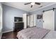 Bedroom featuring a dark wood dresser, flat screen TV and closet at 500 N Roosevelt Ave # 26, Chandler, AZ 85226