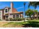 Exterior view showing manicured lawn, mature trees, and architectural detail at 500 N Roosevelt Ave # 26, Chandler, AZ 85226