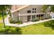 Charming home with lush landscaping, green grass, and walkway leading to front door at 500 N Roosevelt Ave # 26, Chandler, AZ 85226