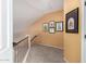 Upstairs hallway with a view of the stairwell, and decorated with artwork at 500 N Roosevelt Ave # 26, Chandler, AZ 85226