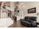 Living room boasts soaring ceilings, an open staircase, and dark wood floors at 500 N Roosevelt Ave # 26, Chandler, AZ 85226