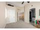 Neutral-toned loft featuring a walk-in closet, and a doorway to the upper level at 500 N Roosevelt Ave # 26, Chandler, AZ 85226