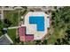 Aerial perspective of a rectangular pool surrounded by lounge chairs, providing a refreshing community space at 500 N Roosevelt Ave # 26, Chandler, AZ 85226