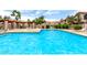 Community pool offers sparkling water, lounge chairs, and shaded pergola for relaxing on sunny days at 500 N Roosevelt Ave # 26, Chandler, AZ 85226
