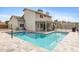Inviting backyard featuring a sparkling pool and well-maintained landscaping at 5020 E Dallas St, Mesa, AZ 85205