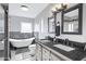 Bright bathroom boasts a clawfoot tub, a double sink vanity, and modern lighting fixtures at 5020 E Dallas St, Mesa, AZ 85205