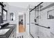 Bathroom featuring a walk-in shower, double vanity, and contemporary design at 5020 E Dallas St, Mesa, AZ 85205