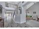 Grand foyer with marble flooring, modern staircase, and an adjacent recreation room at 5020 E Dallas St, Mesa, AZ 85205