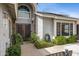 Home featuring a beautifully landscaped front entrance and ornate metal security doors at 5020 E Dallas St, Mesa, AZ 85205