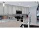 Updated kitchen showcasing granite countertops, stainless steel appliances, and custom cabinetry at 5020 E Dallas St, Mesa, AZ 85205