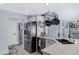 Bright kitchen featuring a stainless steel fridge and granite countertops at 5020 E Dallas St, Mesa, AZ 85205