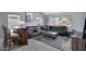 Living room featuring plush seating, a bar, and ample natural light for entertaining at 5020 E Dallas St, Mesa, AZ 85205