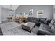 Open concept living room featuring a wet bar, pool table, and comfortable seating at 5020 E Dallas St, Mesa, AZ 85205
