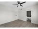 Bedroom showcasing wood-look floors and en-suite bathroom at 520 N Stapley Dr # 166, Mesa, AZ 85203