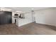 Open floor plan showcasing a kitchen with stainless steel appliances, white cabinetry, and a modern backsplash at 520 N Stapley Dr # 166, Mesa, AZ 85203