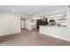 Bright and open-concept area with a kitchen view, hardwood floors, and modern accents, perfect for entertaining at 520 N Stapley Dr # 166, Mesa, AZ 85203