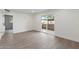 Spacious living room featuring sliding glass doors to the backyard and modern flooring throughout at 520 N Stapley Dr # 166, Mesa, AZ 85203