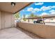 Cozy patio with a view of the parking and clear blue sky. It has concrete flooring and a textured wall at 520 N Stapley Dr # 166, Mesa, AZ 85203
