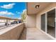 Inviting patio with sliding glass doors and a view of covered parking with cars and a blue sky at 520 N Stapley Dr # 166, Mesa, AZ 85203