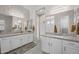 Elegant bathroom features dual granite vanities, modern lighting, and a spacious layout at 5250 S Wesley Cir, Mesa, AZ 85212