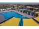 Inviting community pool featuring lounge chairs, shaded seating, and a splash fountain, perfect for relaxation and recreation at 5250 S Wesley Cir, Mesa, AZ 85212
