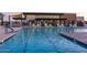 Inviting community pool showcasing clear blue water, comfortable lounge chairs, and modern amenities for residents' enjoyment at 5250 S Wesley Cir, Mesa, AZ 85212
