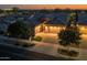 Beautiful home with a well-maintained lawn, mature trees, and a paved driveway leading to a two-car garage at 5250 S Wesley Cir, Mesa, AZ 85212