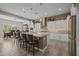 Bright kitchen featuring a spacious island with seating and ample cabinet storage and stylish countertops at 5250 S Wesley Cir, Mesa, AZ 85212