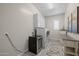 Spacious laundry room with modern washer, dryer, cabinetry and beverage fridge at 5250 S Wesley Cir, Mesa, AZ 85212