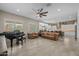 Open concept living room seamlessly connects to the kitchen with modern decor and a spacious layout at 5250 S Wesley Cir, Mesa, AZ 85212