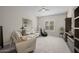 Comfortable living room with ceiling fan, plush carpet and reclining furniture at 5250 S Wesley Cir, Mesa, AZ 85212