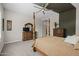 Stylish main bedroom features plush carpet, ceiling fan and a four-poster bed at 5250 S Wesley Cir, Mesa, AZ 85212