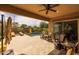 Outdoor patio with lounge area, view of the pool, desert landscaping, and complete privacy at 5250 S Wesley Cir, Mesa, AZ 85212