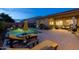 Inviting backyard pool area with lounge chairs and a covered patio, perfect for outdoor relaxation and entertaining at 5250 S Wesley Cir, Mesa, AZ 85212