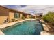 Beautiful backyard with pool, outdoor kitchen, and desert landscaping creating a private oasis for relaxation at 5250 S Wesley Cir, Mesa, AZ 85212