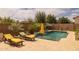 Secluded pool area with lounge chairs and desert landscaping offering a relaxing and private outdoor space at 5250 S Wesley Cir, Mesa, AZ 85212