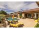 Relaxing backyard pool area with lounge chairs, landscaping, and covered patio, ideal for outdoor enjoyment at 5250 S Wesley Cir, Mesa, AZ 85212