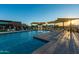 Community pool with splash fountain and sunshades with chairs and tables near clubhouse at 5250 S Wesley Cir, Mesa, AZ 85212