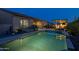 Backyard featuring a sparkling pool, outdoor kitchen area with built in bbq and lush landscaping, creating a private oasis at 5250 S Wesley Cir, Mesa, AZ 85212