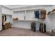 Large walk-in closet with built-in shelving and ample storage space for clothes and accessories at 5250 S Wesley Cir, Mesa, AZ 85212