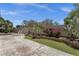 Backyard area with artificial grass, desert landscaping, lounge chairs, and concrete pool deck, perfect for relaxation at 5342 S Citrus Ct, Gilbert, AZ 85298