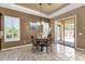 Eat-in dining room with decorative chandelier and sliding door access to the outdoor patio at 5342 S Citrus Ct, Gilbert, AZ 85298