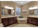 This primary bathroom features dual sinks, separate tub, and vanity at 5342 S Citrus Ct, Gilbert, AZ 85298
