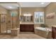 Bright primary bathroom with a walk-in shower, dual sinks, and soaking tub at 5342 S Citrus Ct, Gilbert, AZ 85298
