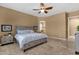 This bedroom features a ceiling fan and attached ensuite bath at 5342 S Citrus Ct, Gilbert, AZ 85298