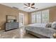 This bedroom features a ceiling fan, shutters, and dresser at 5342 S Citrus Ct, Gilbert, AZ 85298