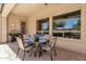 Covered outdoor dining area with elegant table setting and views of the landscaped yard at 5342 S Citrus Ct, Gilbert, AZ 85298